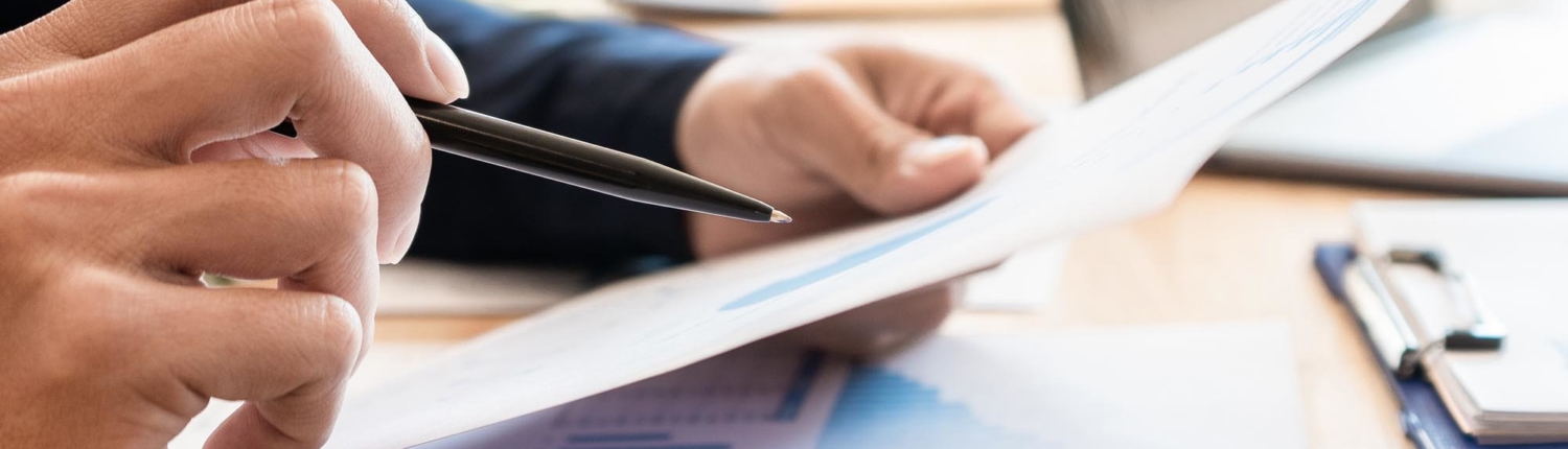 Close up view of person looking over document