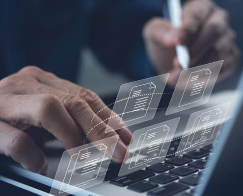 close up of man working on a laptop