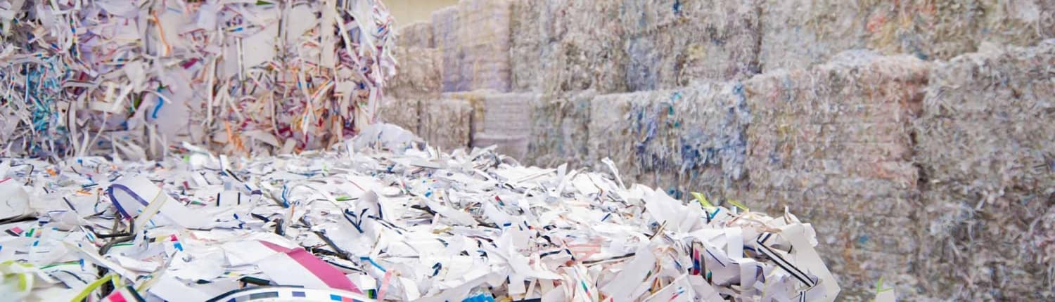 thousands of shredded paper piled up into blocks