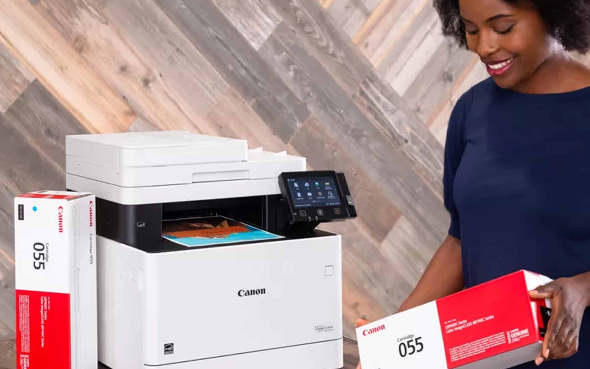 Side view of a woman using a canon printer