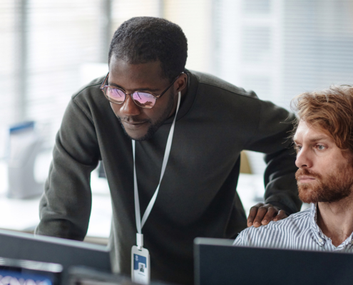 Workers looking at computer