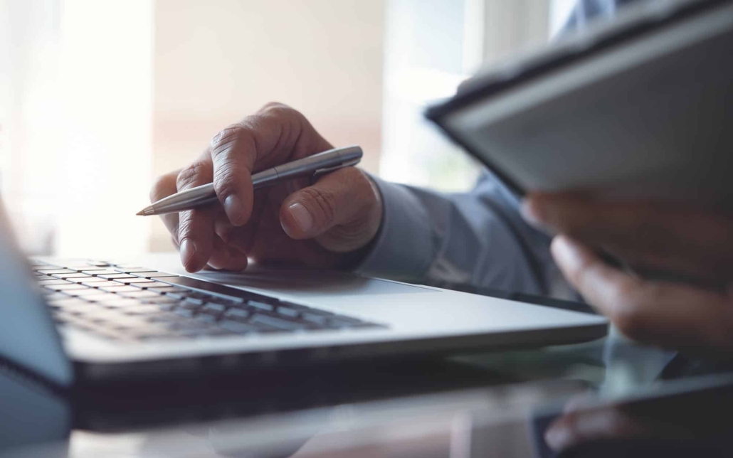 Close Up View Of A Person Doing A Telecom Audit
