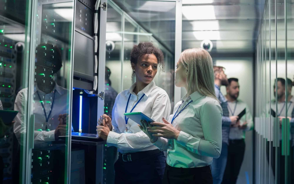 Cloud Services Workers Looking Over Servers