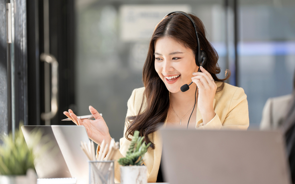 Helpdesk Representative Talking To Client With Headset