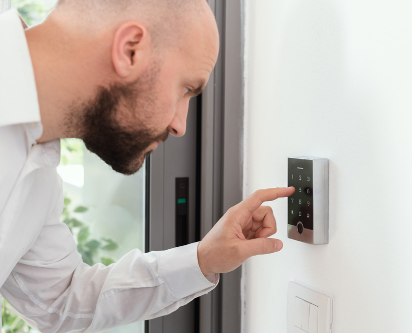 Side View Of Man Typing On Access Control Number Pad
