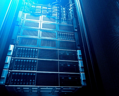 Bottom View Of Rack Server Against Neon Fluorescent Light In Data Center