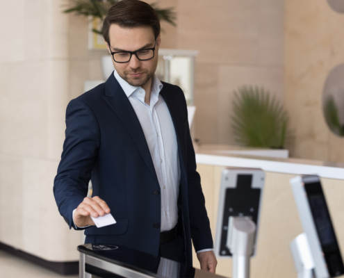Business Person Using Key Card To Access Building 1