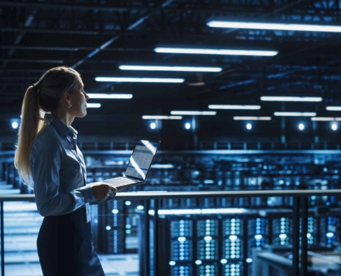 Data Center Female It Specialist Uses Laptop Computer