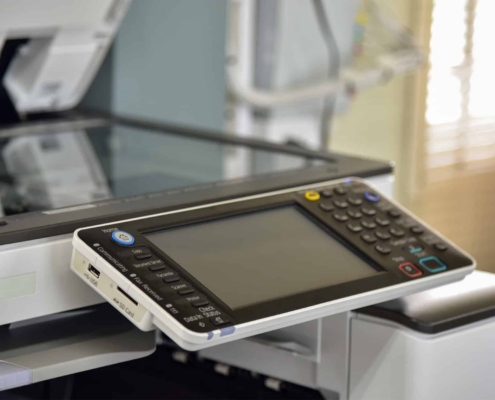 Side View Of Modern Printer With Screen In An Office Space