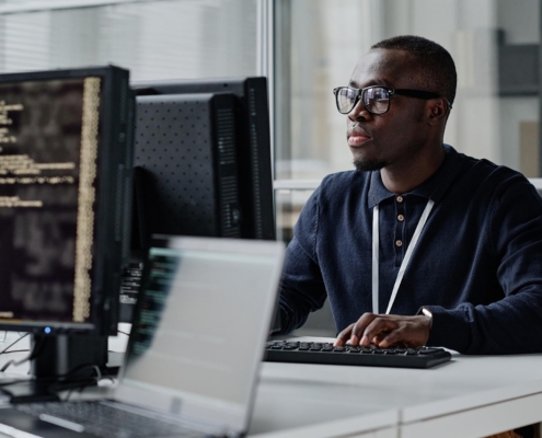 Tech Professional Working On Computer